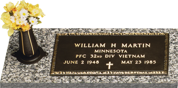 Gravestone of William H. Martin with vase of flowers. Bronze plaque: name, dates, cross.