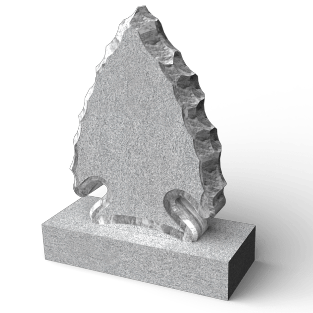 Stone arrowhead sculpture on a stone block base.
