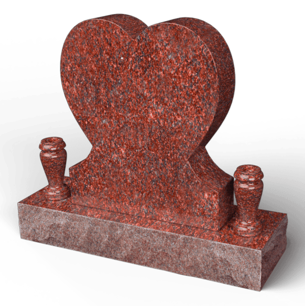 Red granite heart-shaped headstone with two vases on a rectangular base.