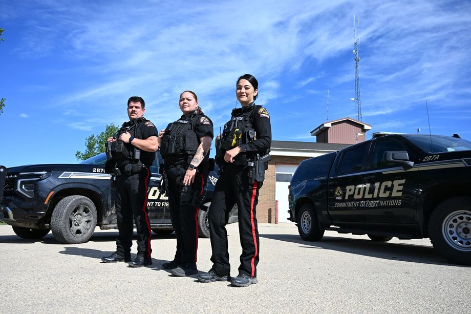 MFNPS-Manitoba First Nations Police Service - Two officers standing with Police cruiser