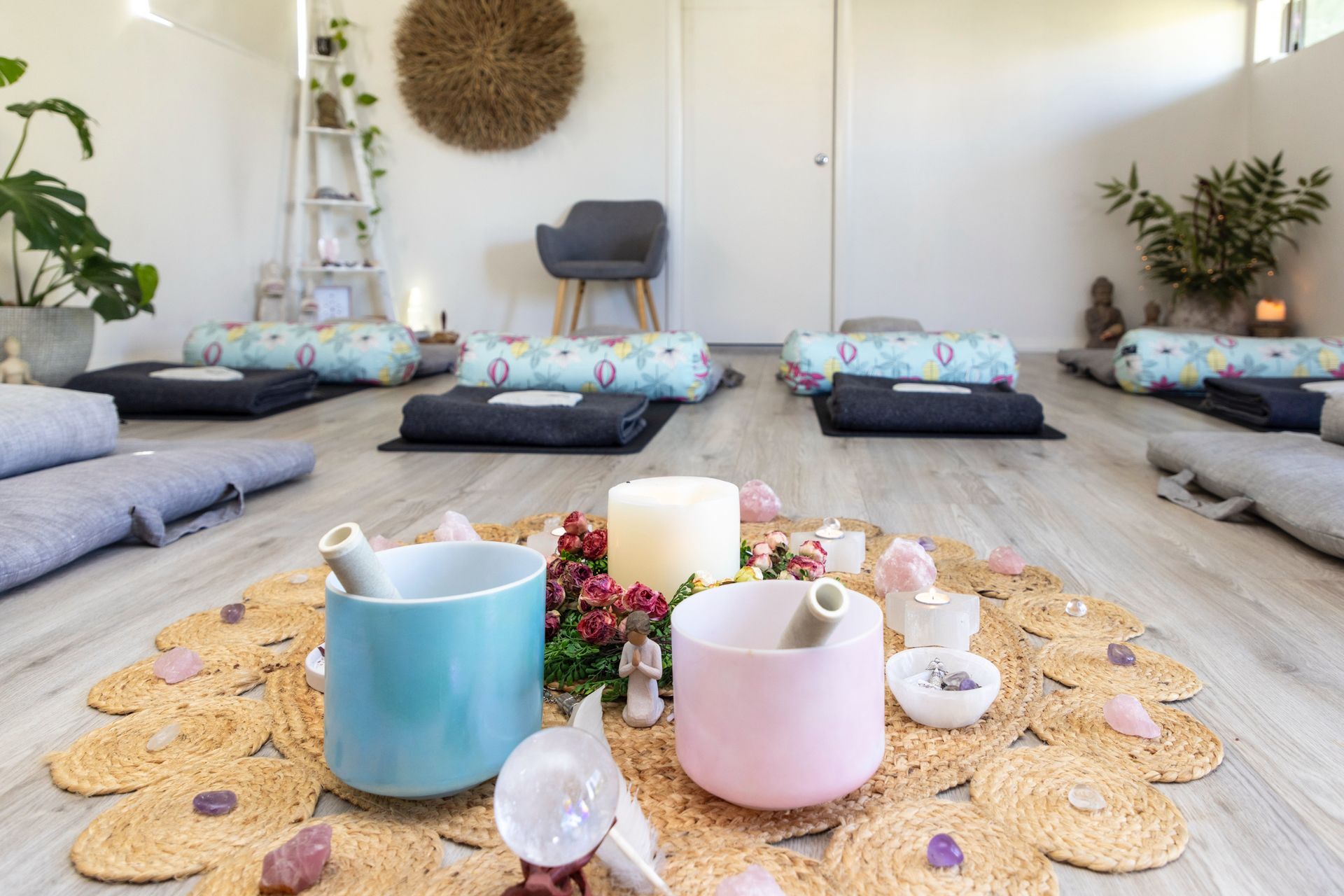 Meditation room with floor cushions, candles, and a woven centerpiece on a bright rug — Soulfully Happy In Springvale, NSW