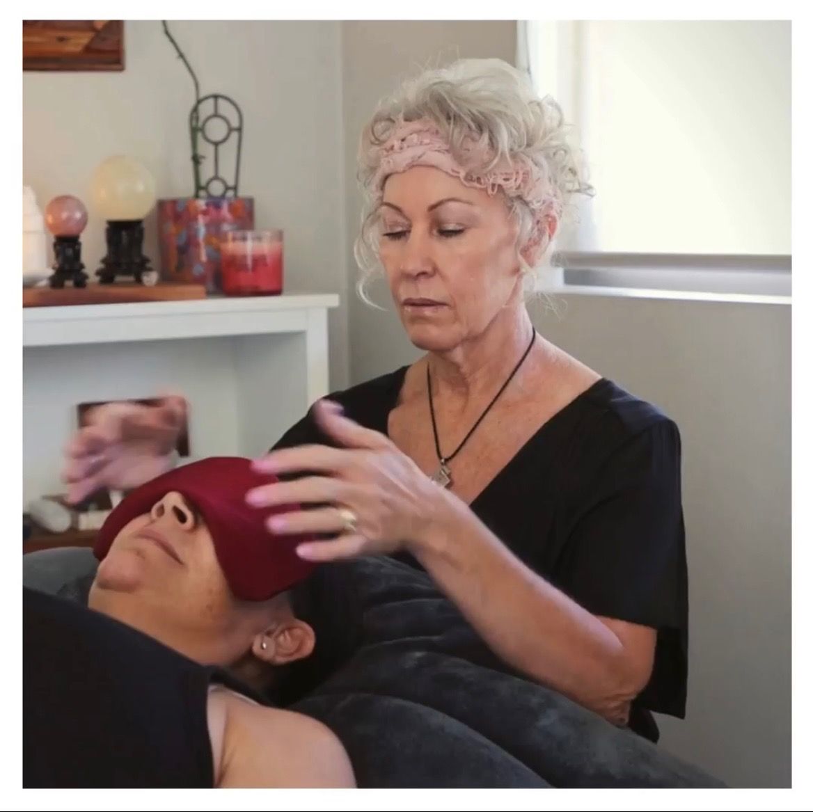 Caregiver gently adjusts a towel on a reclining client in a spa-like treatment room — Soulfully Happy In Springvale, NSW