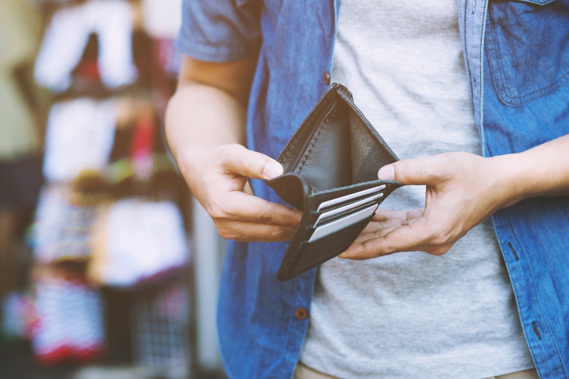 man opening empty wallet