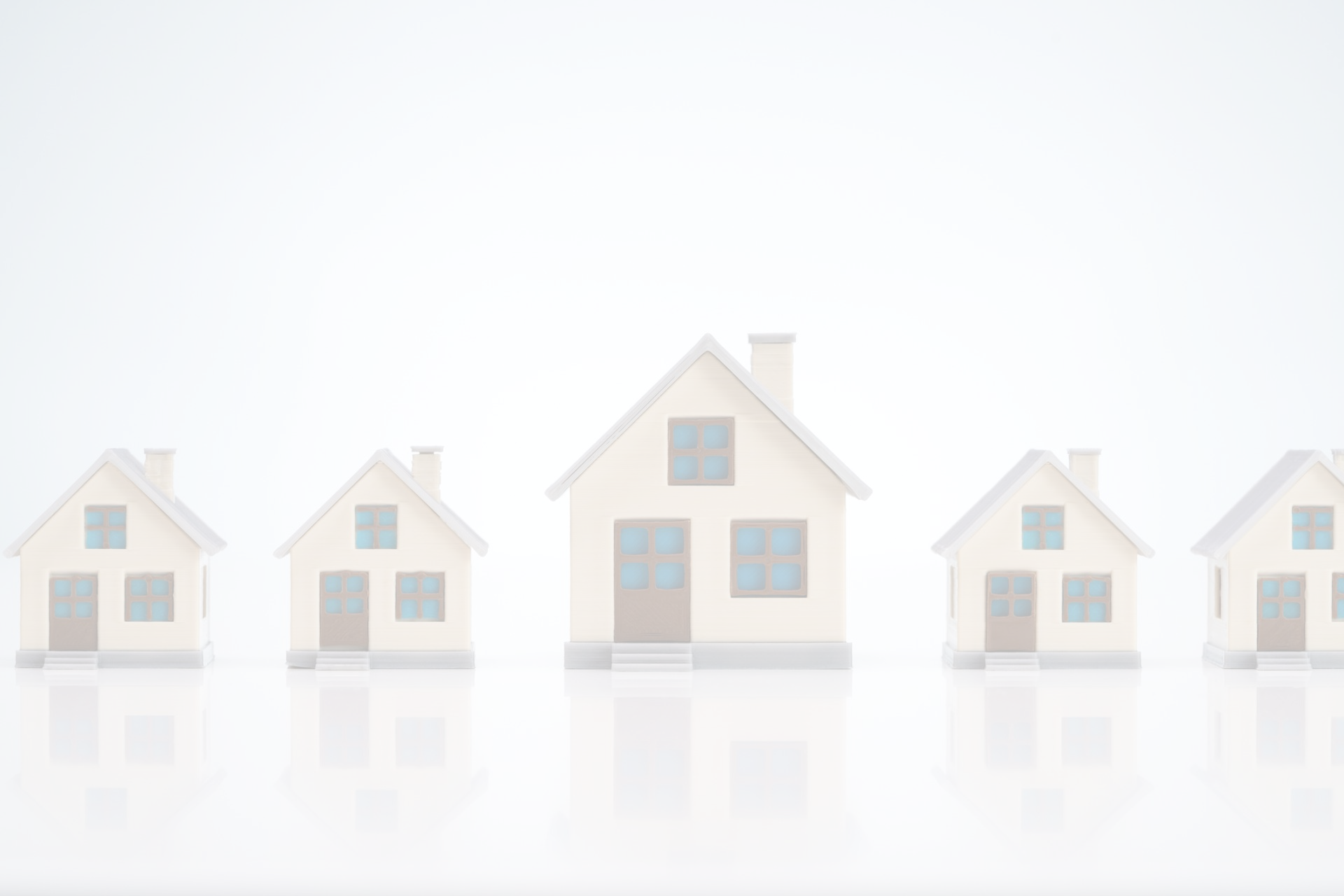 row of block homes on white table