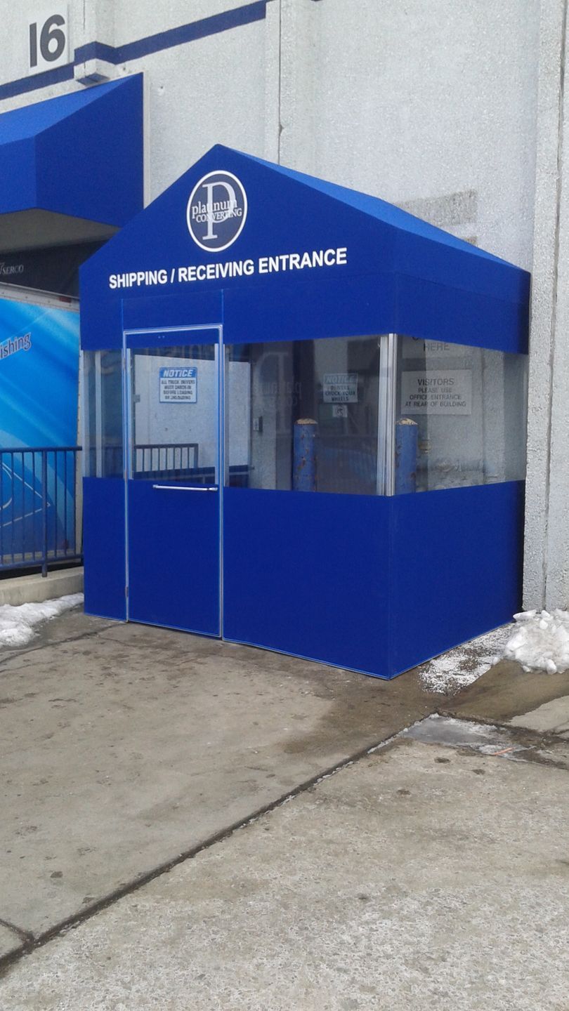 A blue canopy with the word entrance on it