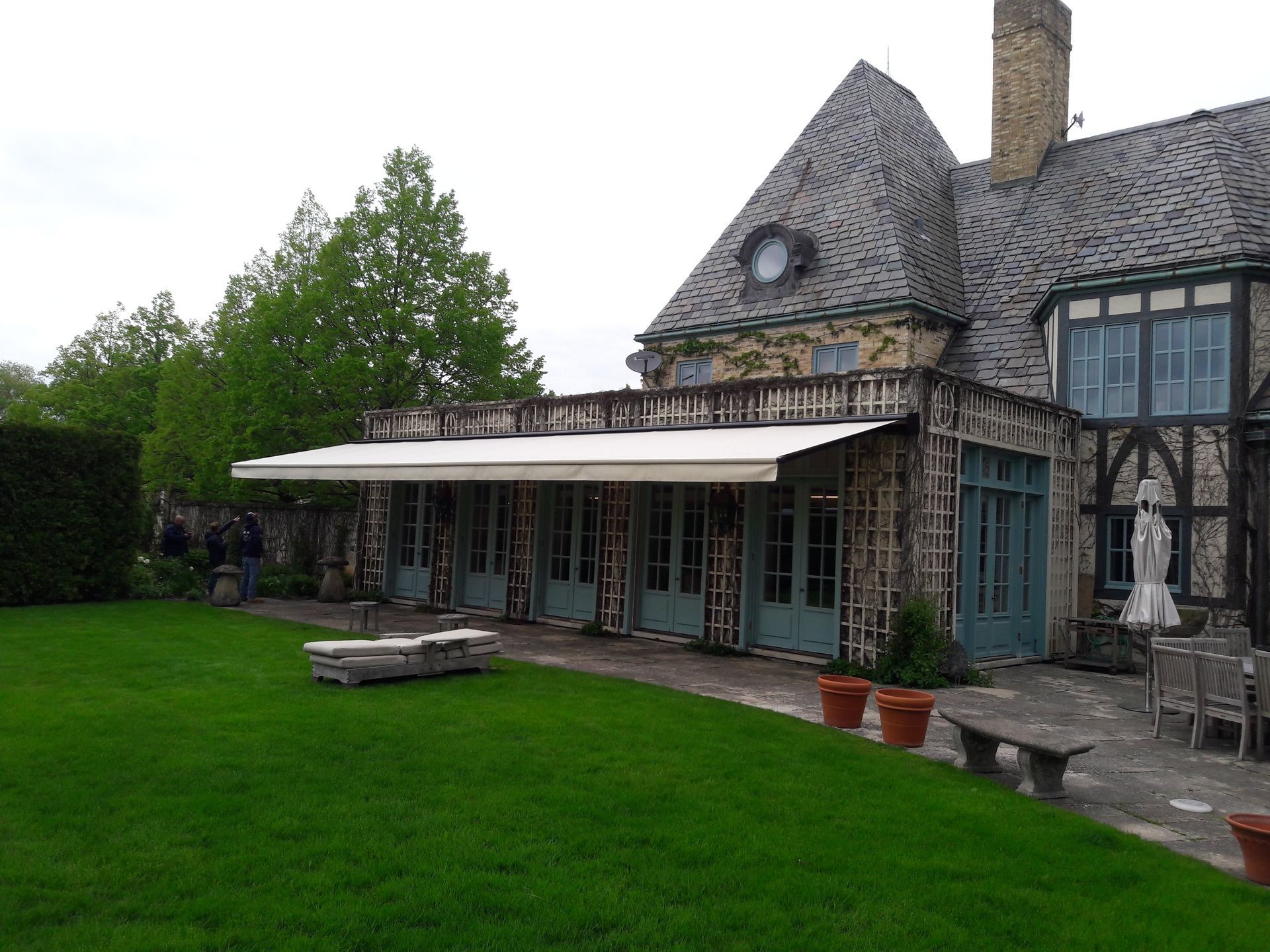 A large house with a large lawn in front of it
