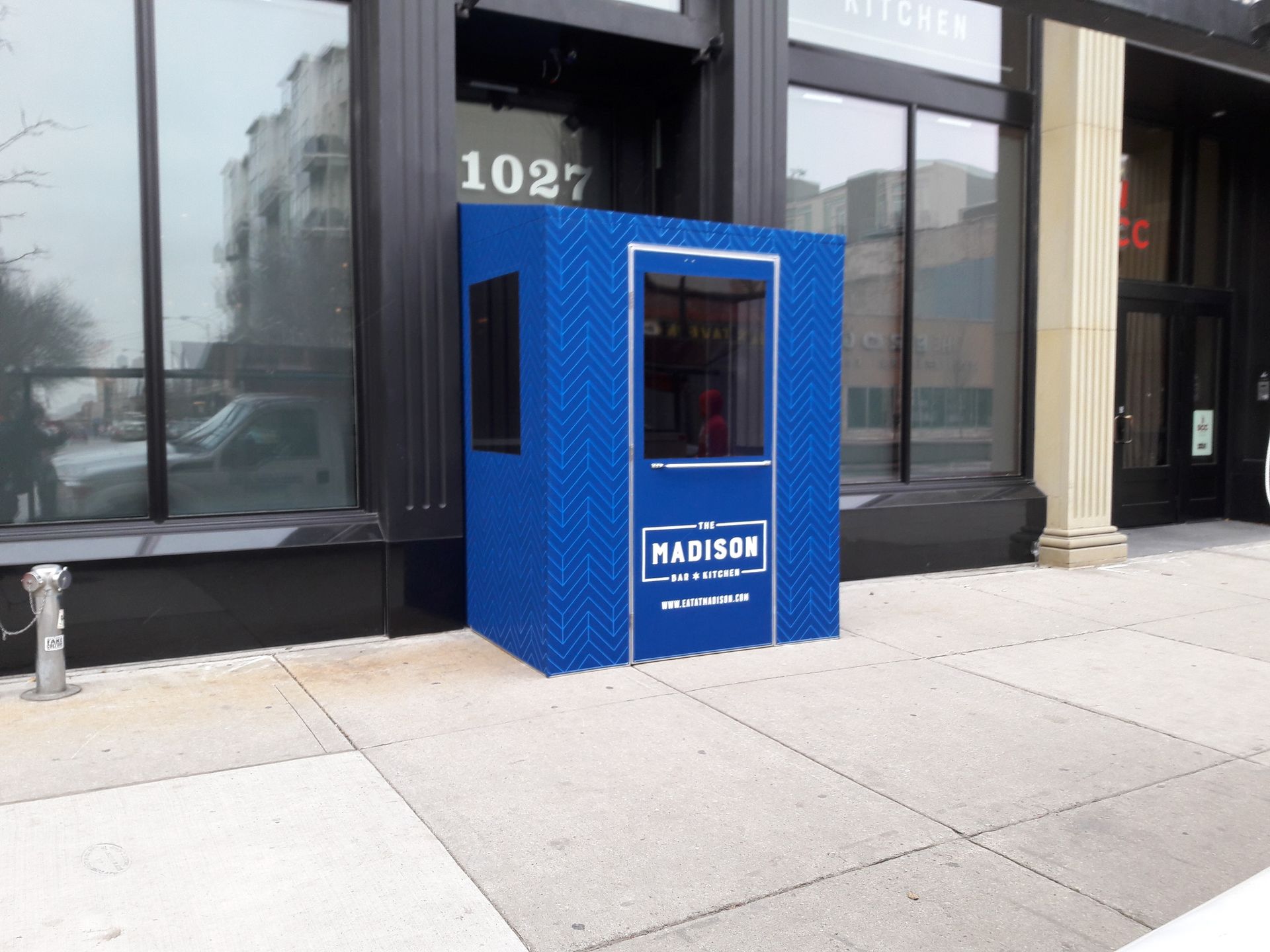 A blue building with the number 1027 on it