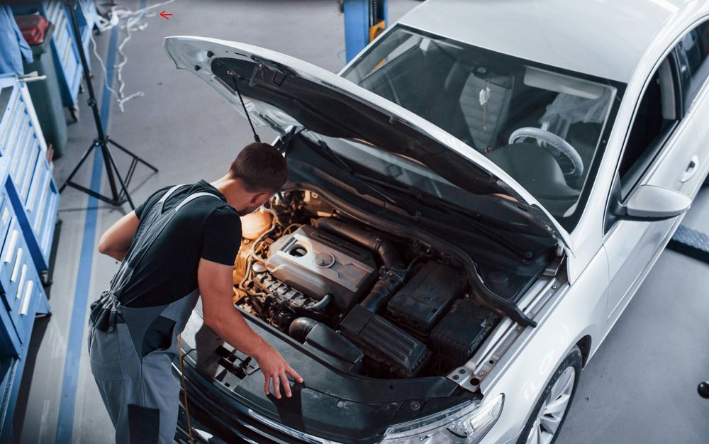Mechanic Checking Car Engine