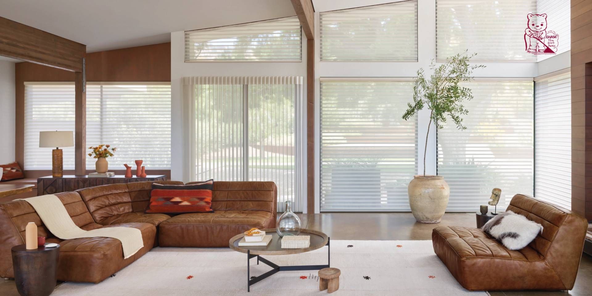 Hunter Douglas sliding panels on a sliding patio door and large windows in a living room