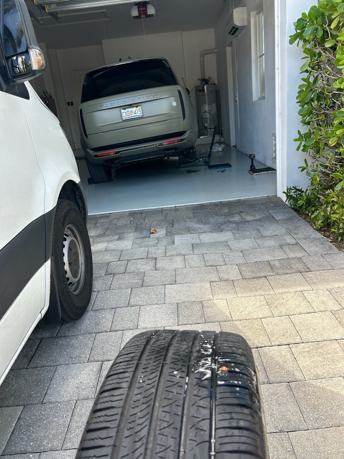 Mobile tire repair van servicing a vehicle in Lauderhill, Florida