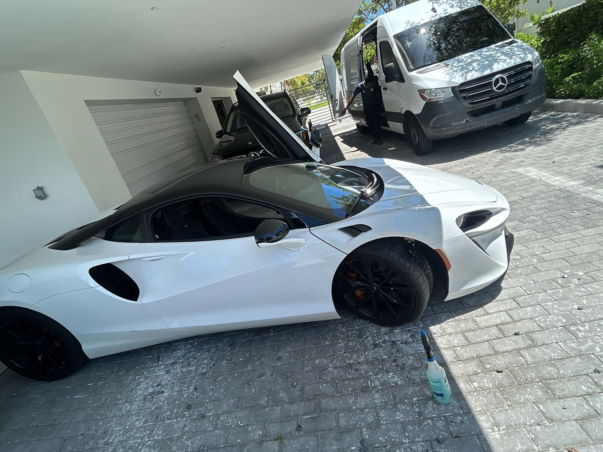 Mobile tire technician servicing a vehicle at a residential property in Lauderhill, Florida