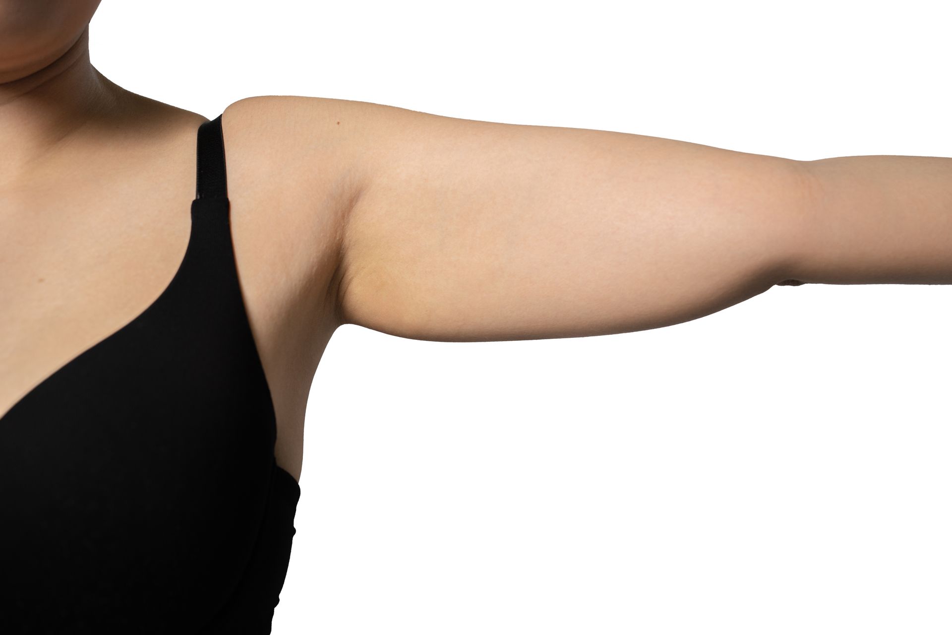 Arm extended sideways, showing a black sleeveless top against a white background