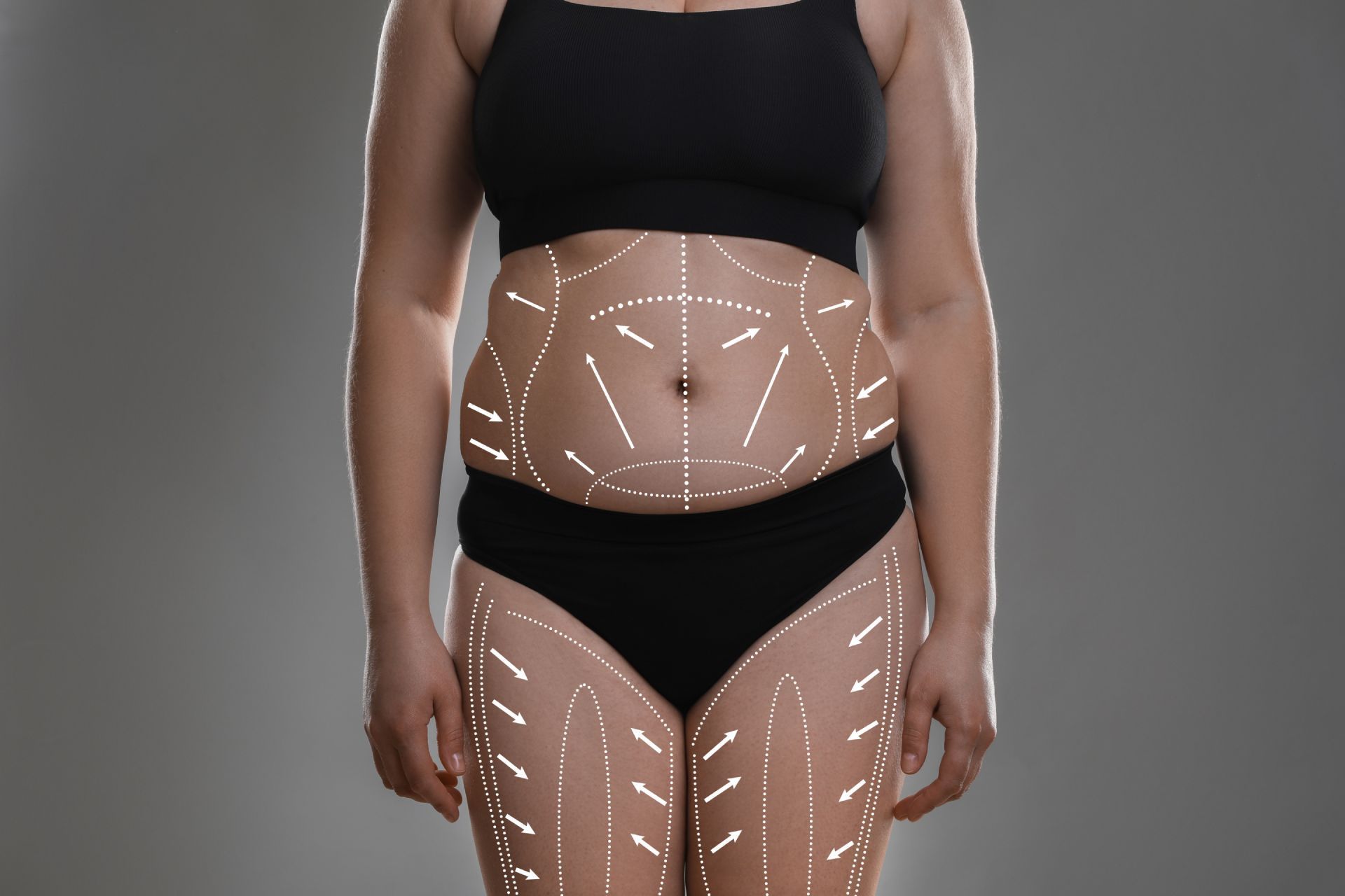 Hands assessing a person’s lower back during a physical therapy or massage session
