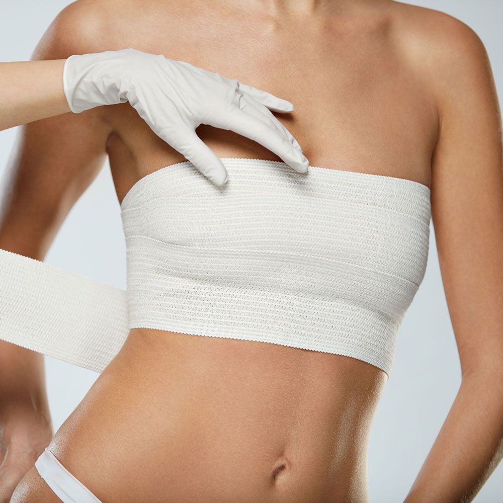 Covering the Woman's Breast with Bondage