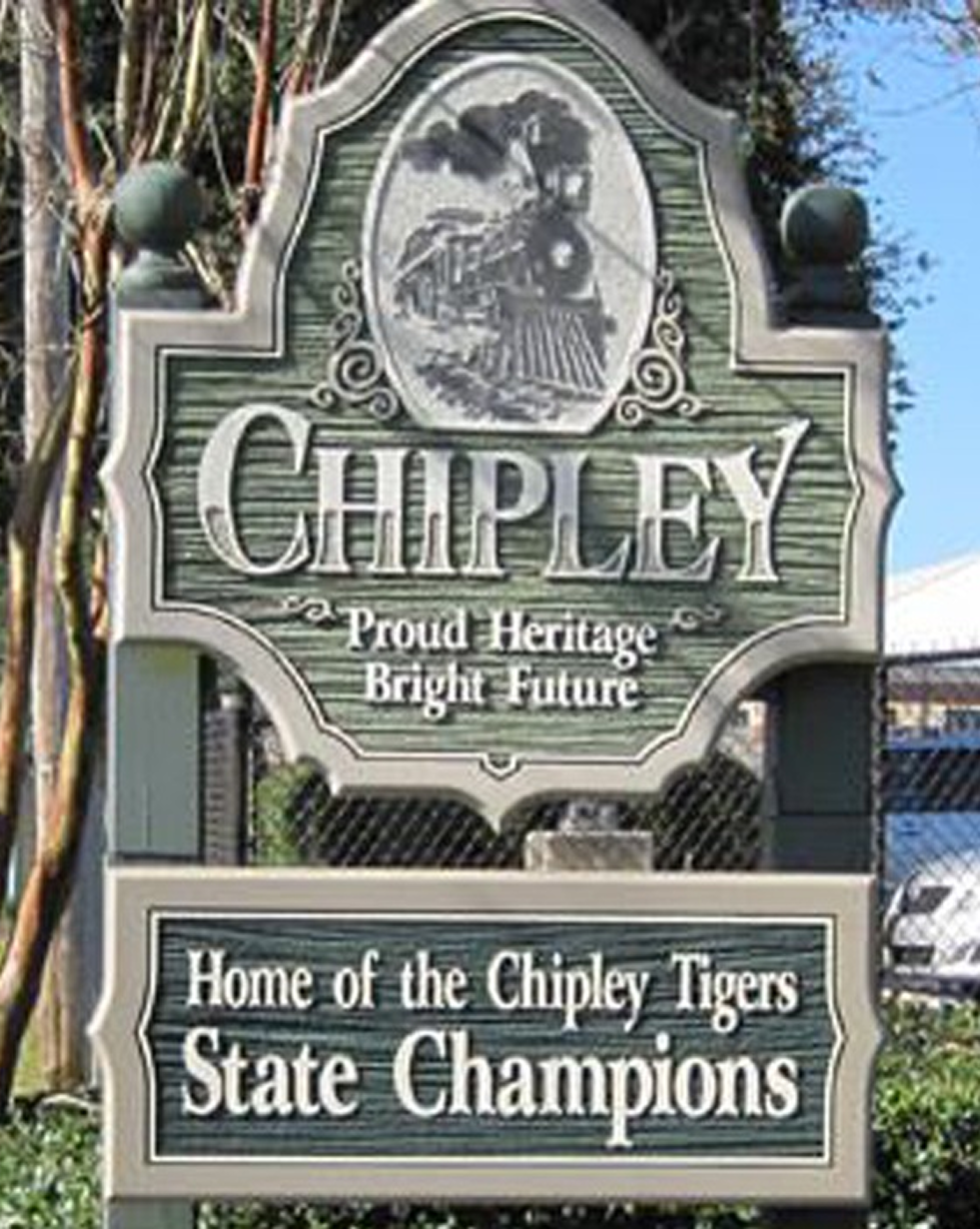Chipley town sign reading “Proud Heritage Bright Future” and “Home of the Chipley Tigers State Champions”