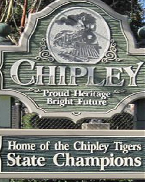 Chipley town sign reading “Proud Heritage Bright Future” and “Home of the Chipley Tigers State Champions”