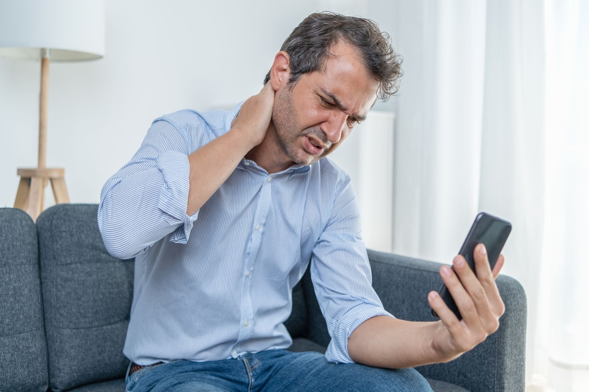 Backache Sitting On The Sofa — Plano, TX — North Texas Center for Pain Management