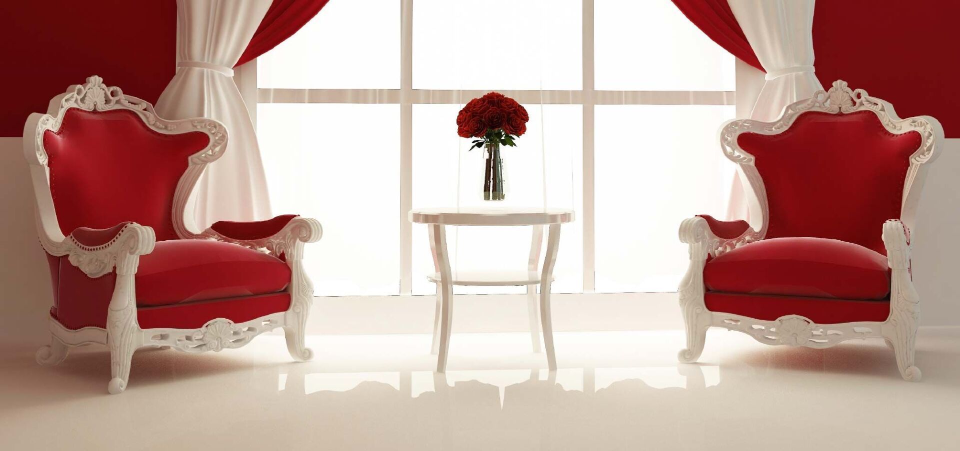 Two ornate red armchairs flanking a small white table with flowers, in a red and white room.