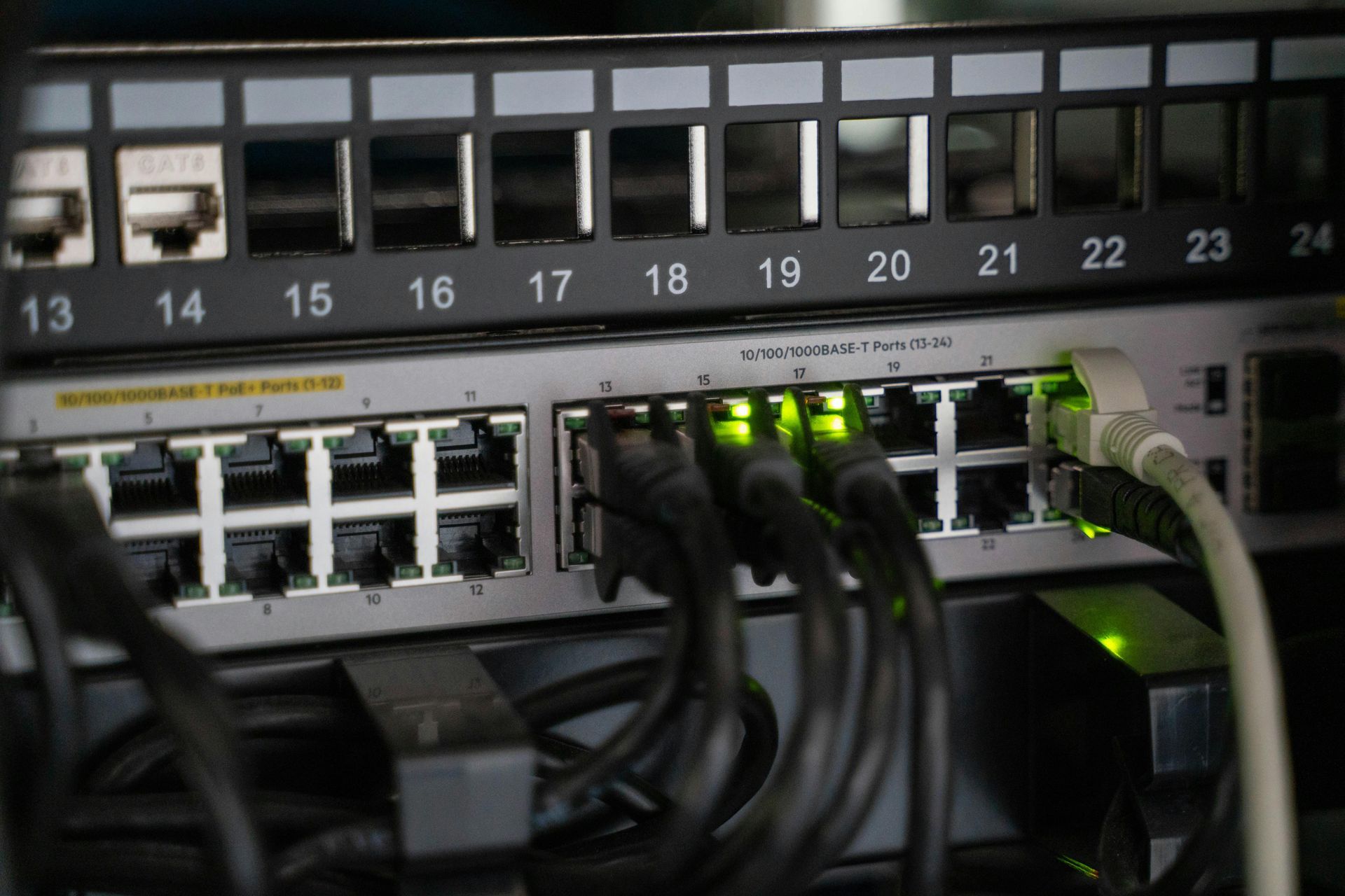 A bunch of wires are connected to a server.