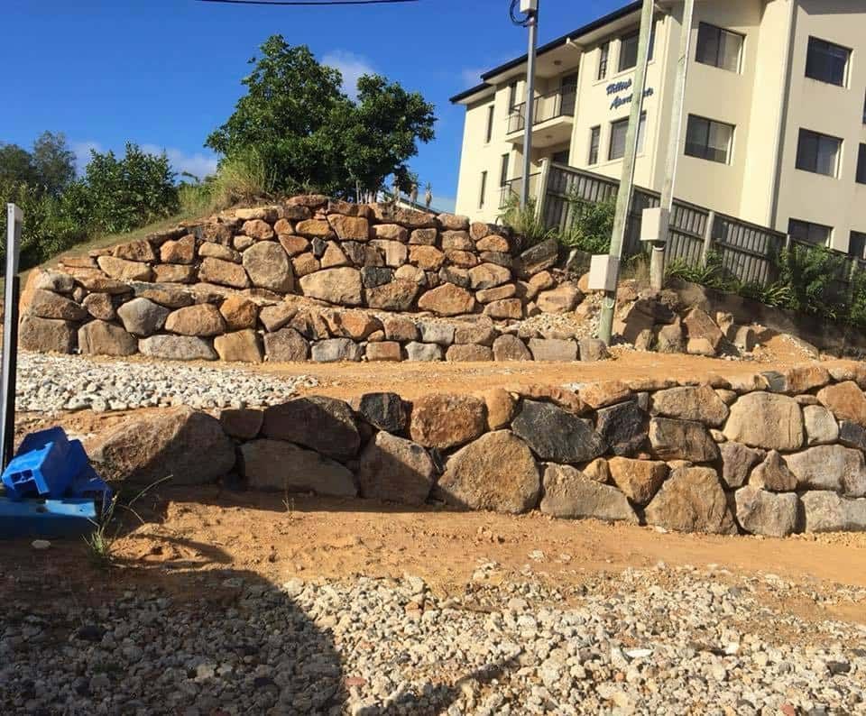 Stone Retaining Wall Under Construction Beside a Apartment Building — Border Rockwalls in Murwillumbah, NSW