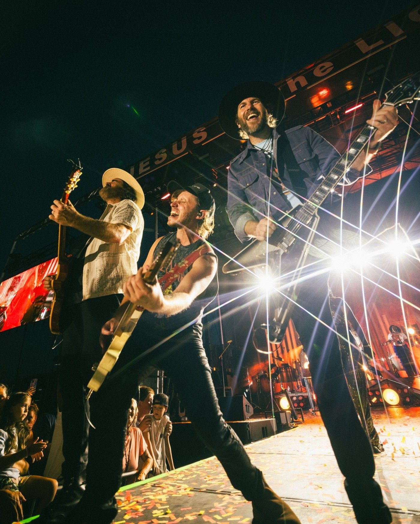 Band performing on stage at a promoted concert