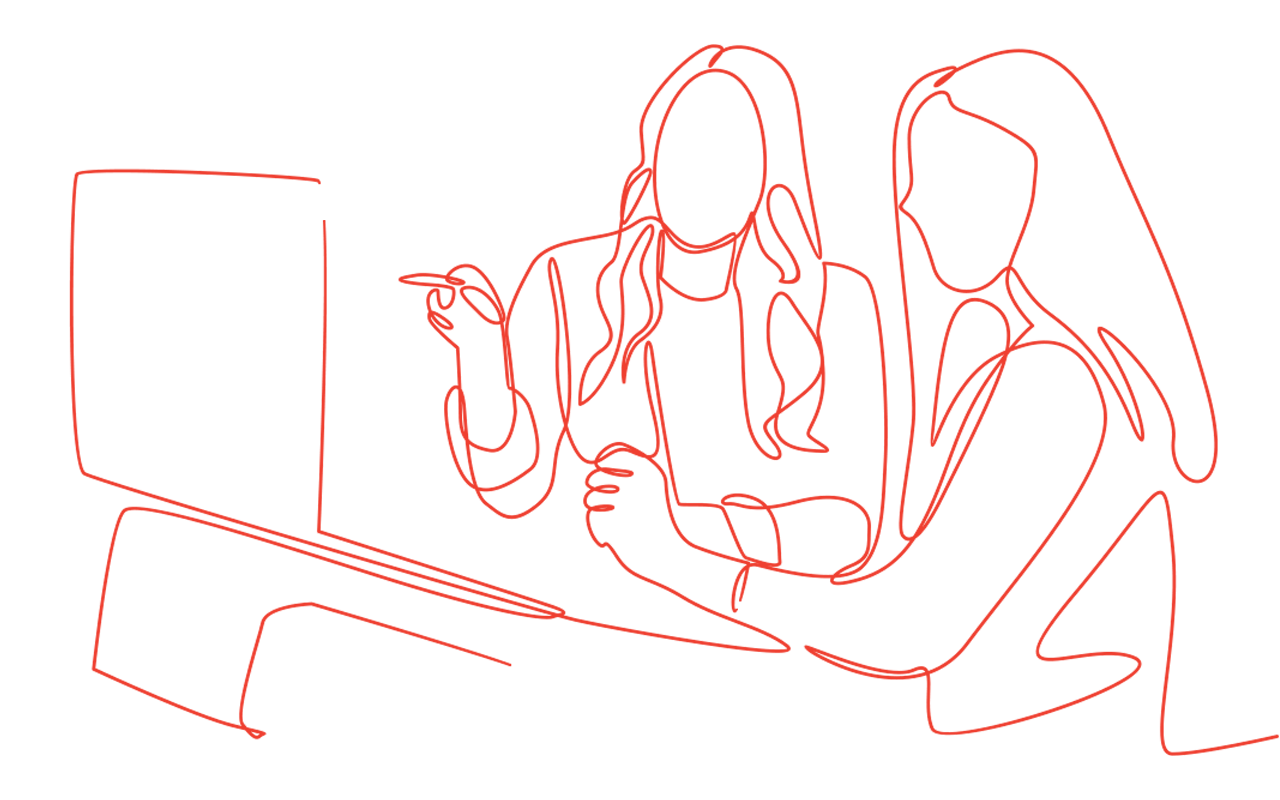 Two women looking at computer screen, one pointing with pen, collaborating.