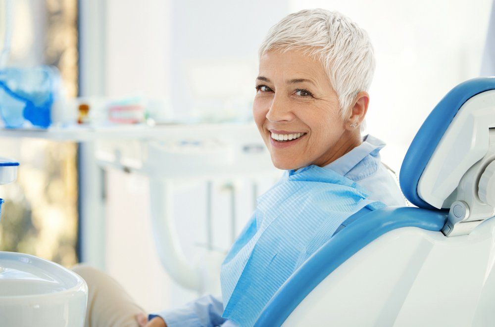 Smiling Woman After Dental Appointment — Lenoir, NC — Wayne Hollar DDS Smiling Woman After Dental Appointment — Lenoir, NC — Wayne Hollar DDS