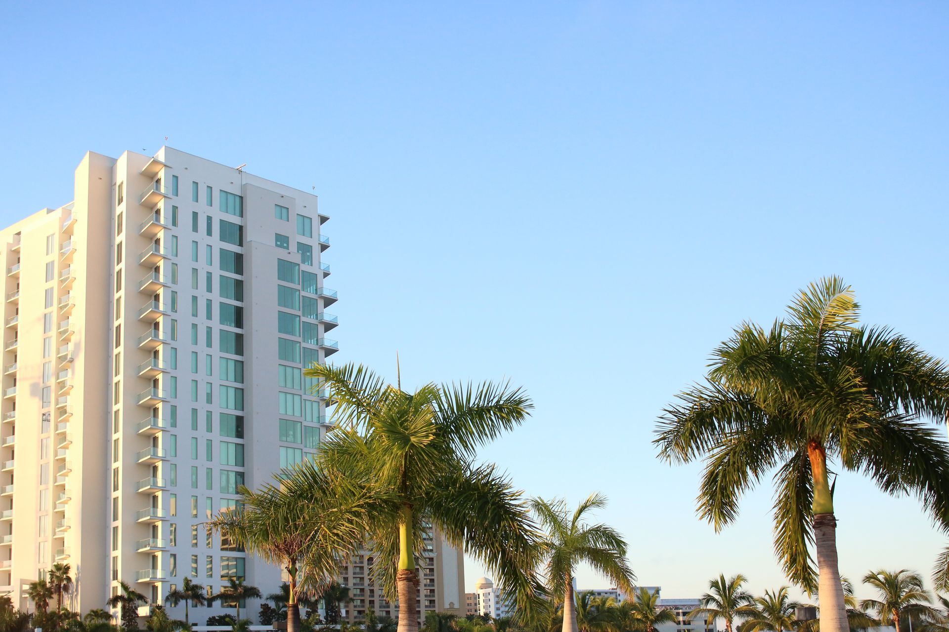 Well-maintained residential duplex investment property in a Miami-Dade neighborhood at golden hour.