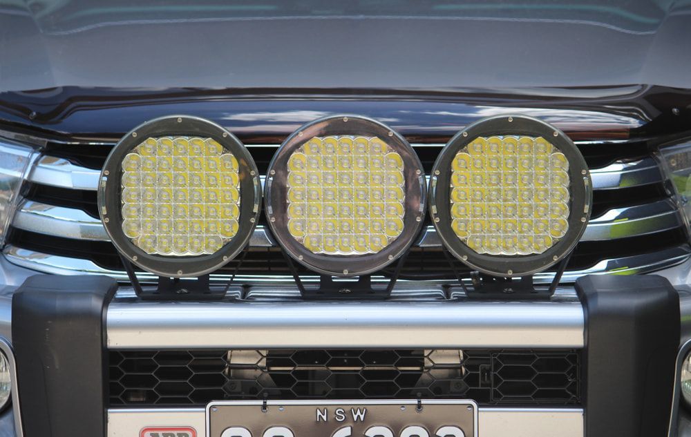 A Vehicle's Front Grille Featuring Three Large Round Led Lights — Norm Beatty's Auto Electrical Service In Bateau Bay, NSW
