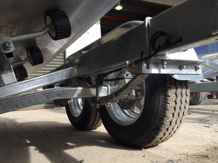 A close up of a trailer with two tires on it
