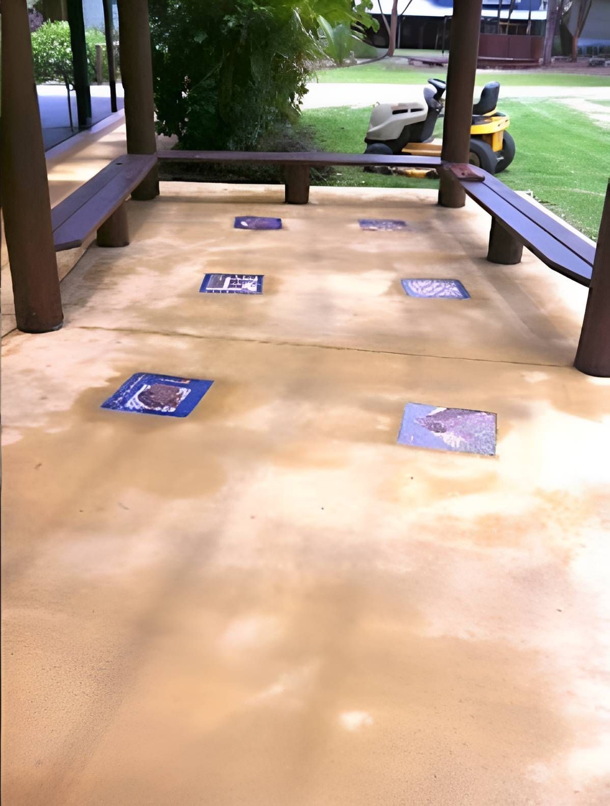 A Picnic Area With A Lawn Mower In The Background — EcoPro Pressure Cleaning In Broadbeach, QLD