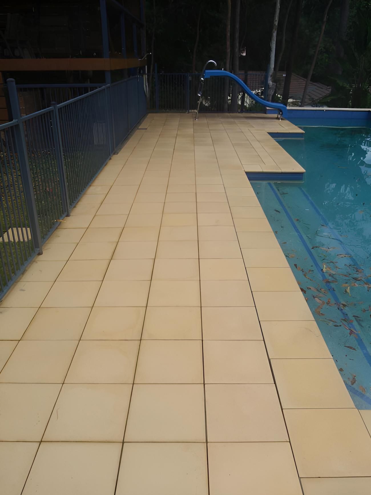 A Tiled Walkway Leading To A Swimming Pool — EcoPro Pressure Cleaning In Southport, QLD