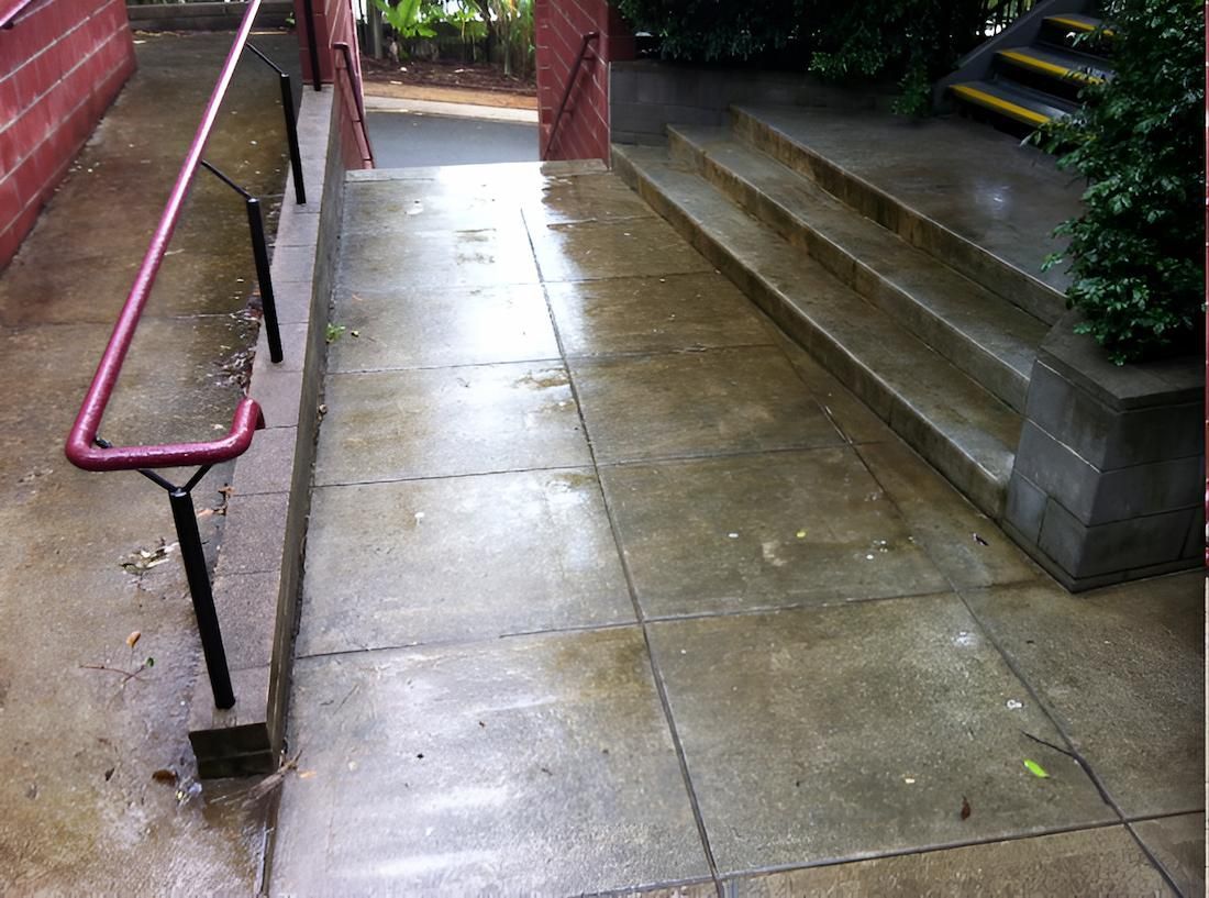 A Concrete Walkway With Stairs And A Red Railing — EcoPro Pressure Cleaning In Brisbane, QLD