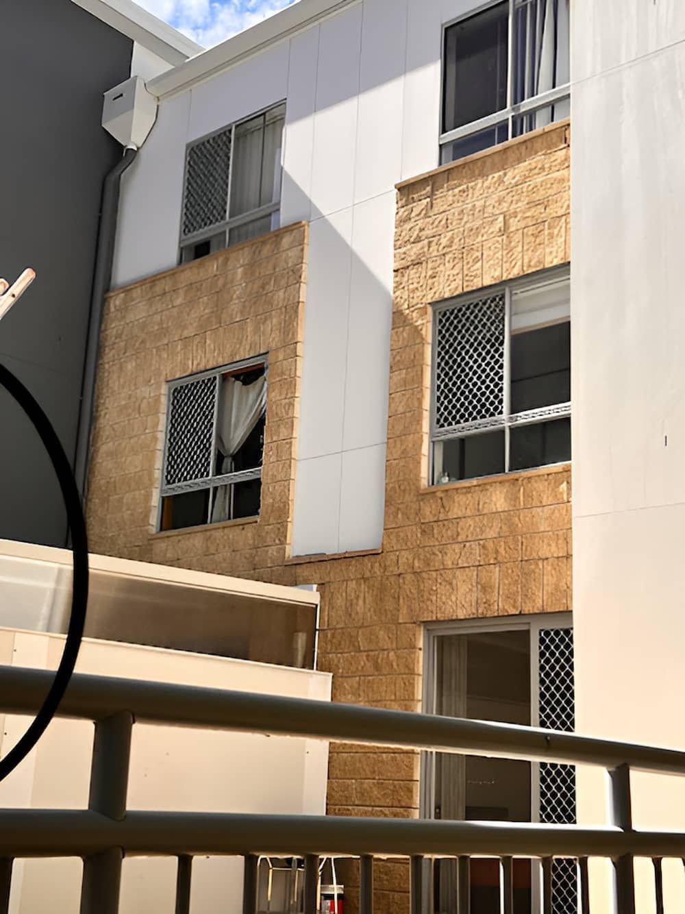 A Building With A Lot Of Windows And A Balcony — EcoPro Pressure Cleaning In Broadbeach Waters, QLD