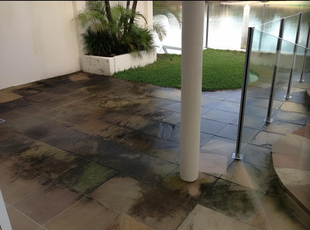A Dirty Tiled Floor With A White Pole In The Middle — EcoPro Pressure Cleaning In Broadbeach Waters, QLD