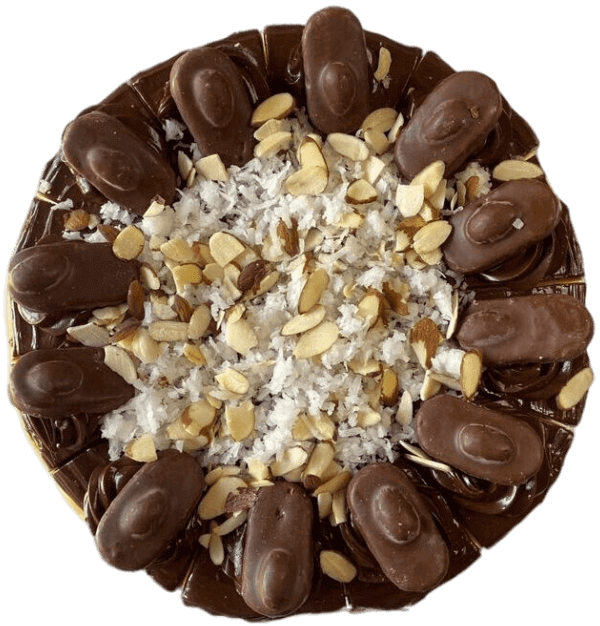 Round chocolate dessert topped with whole chocolates, chopped nuts, and powdered sugar