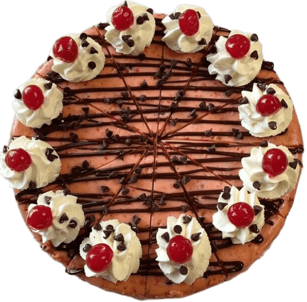 Chocolate cake topped with whipped cream, cherries, chocolate drizzle, and chocolate chips