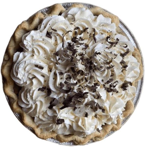 Chocolate pie topped with swirled whipped cream and chocolate shavings