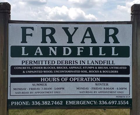 A sign that says fryar landfill on it