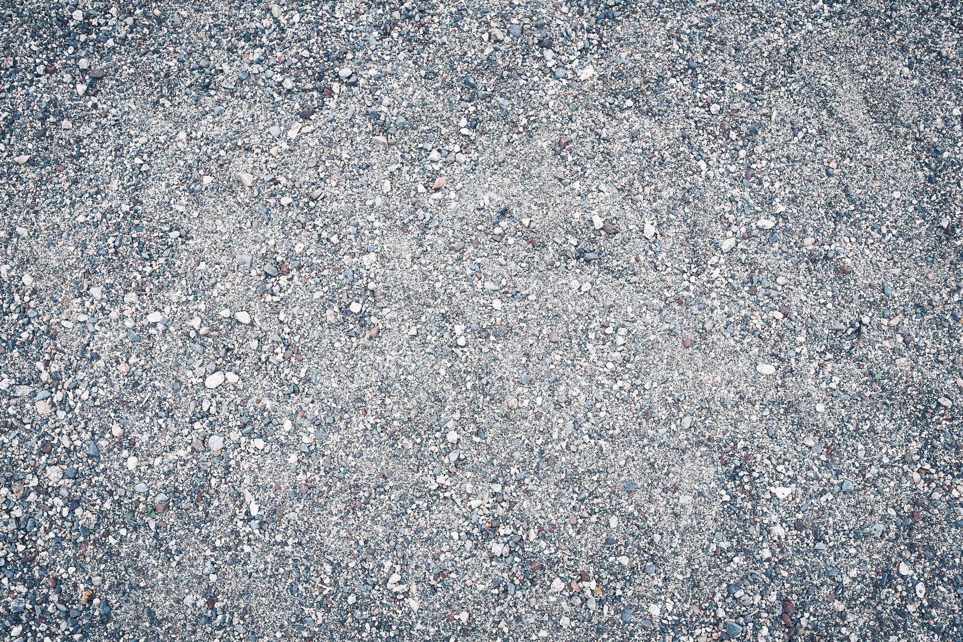 A close up of a pile of gravel on the ground.