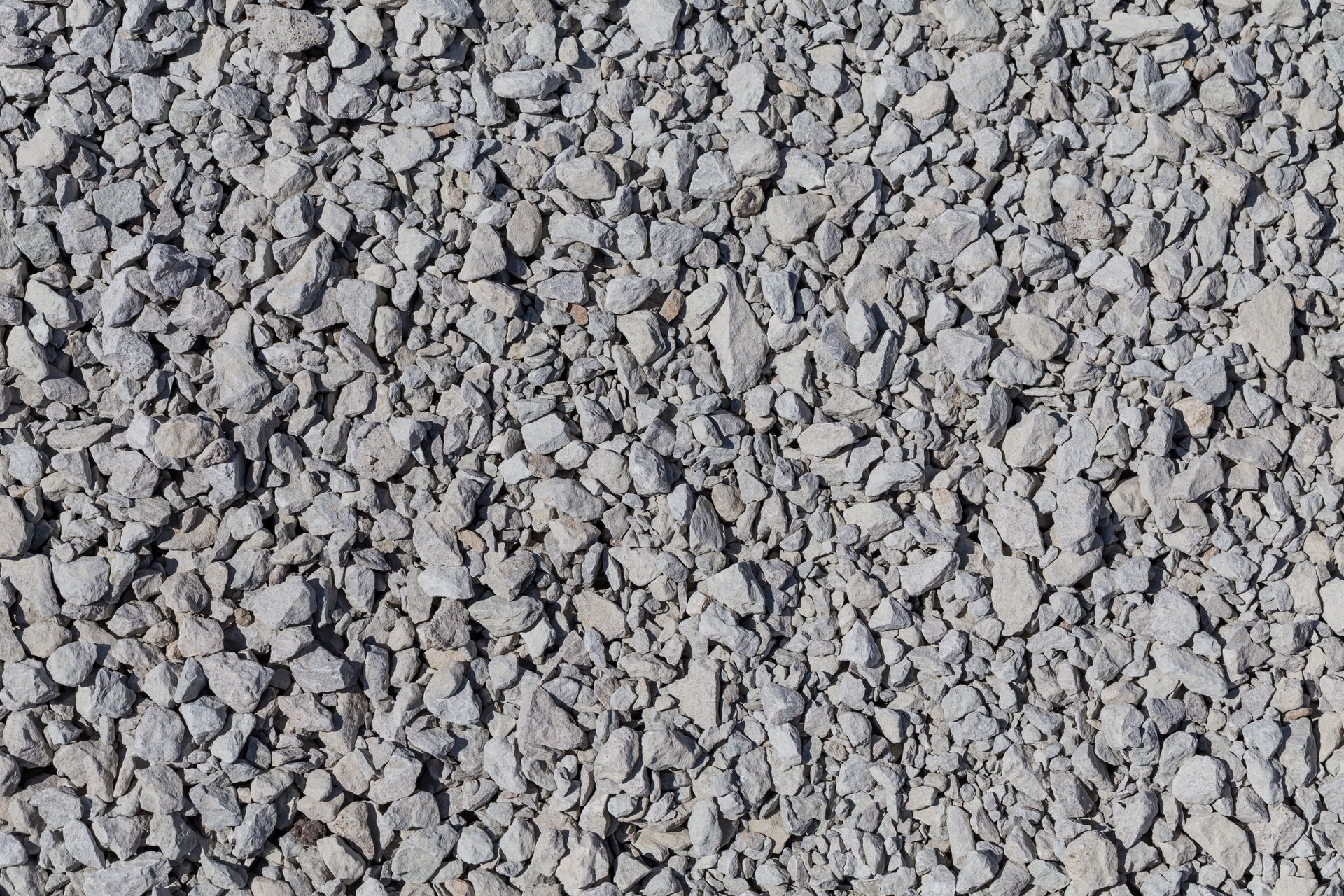 A pile of gravel is sitting on the ground.