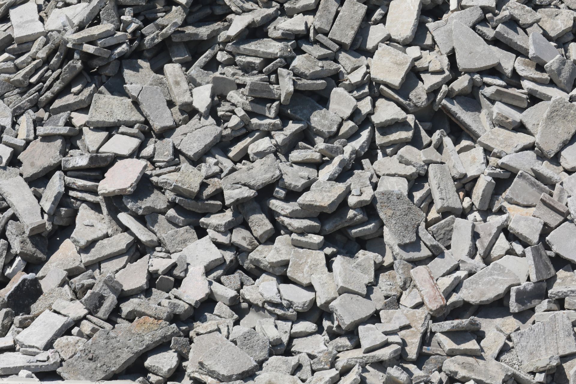 A pile of broken concrete is sitting on the ground.