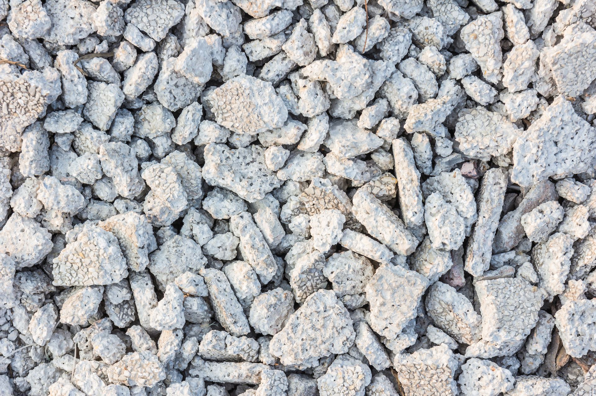 A pile of gravel is sitting on the ground.