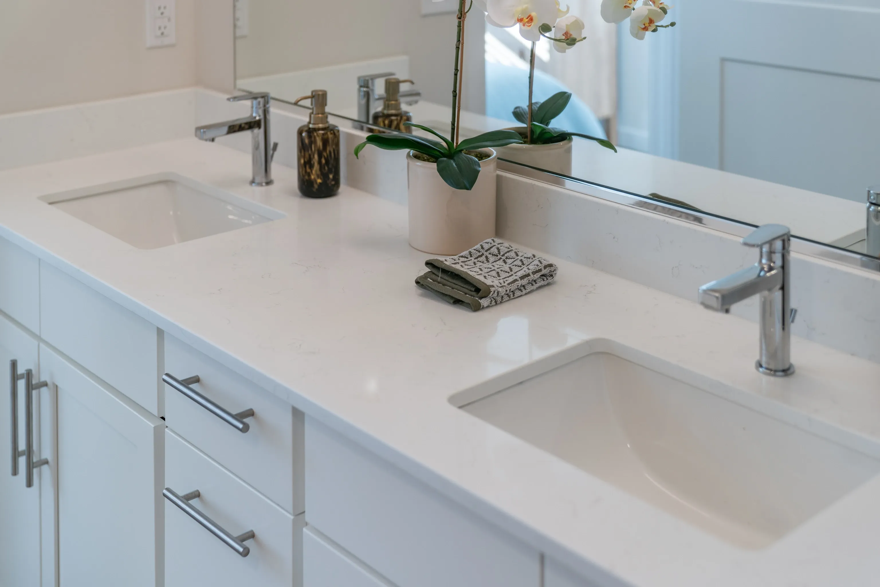 Double vanity bathroom with two sinks and chrome faucets.
