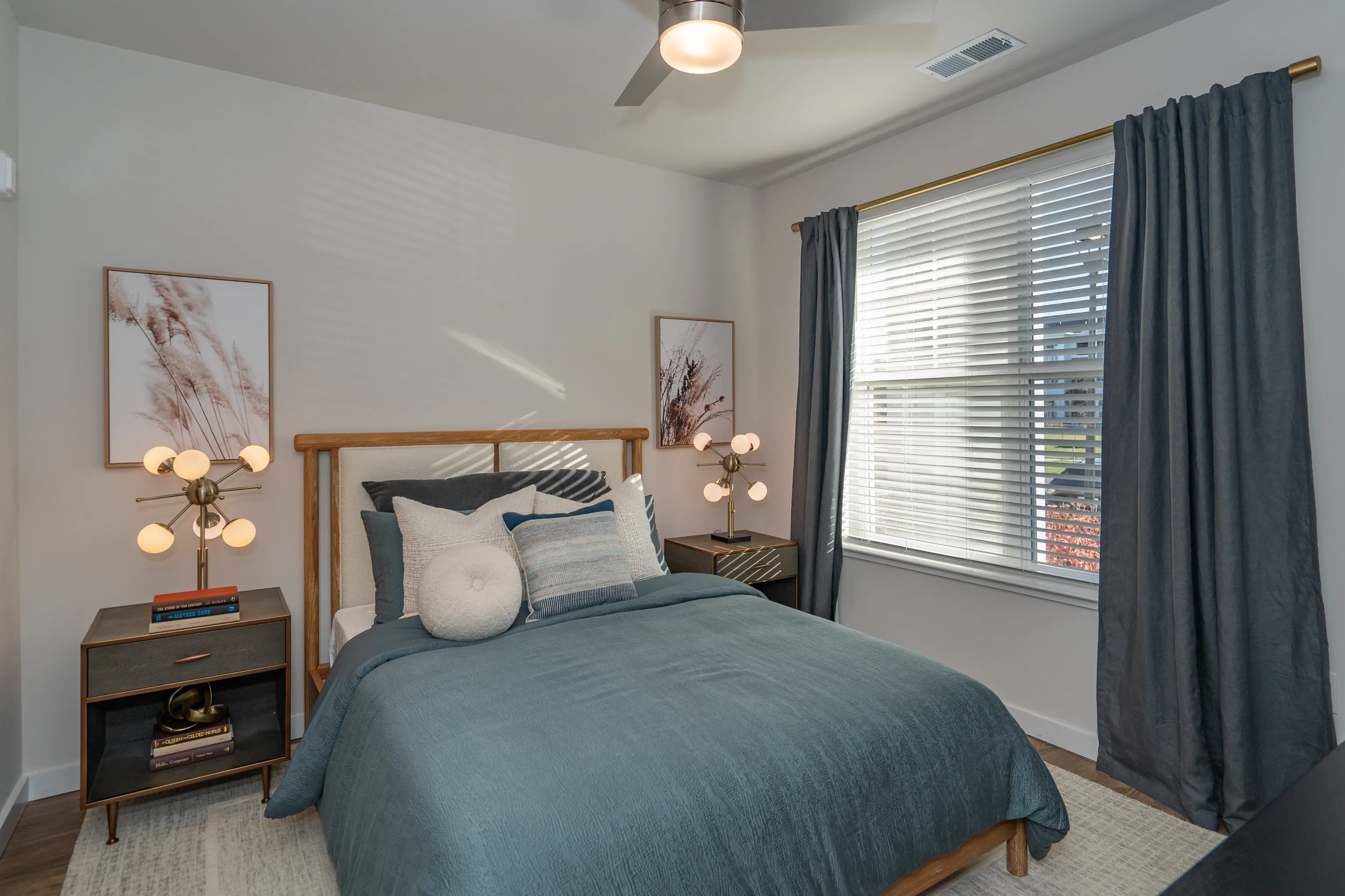 Bedroom with a queen-size bed, nightstands, and window.