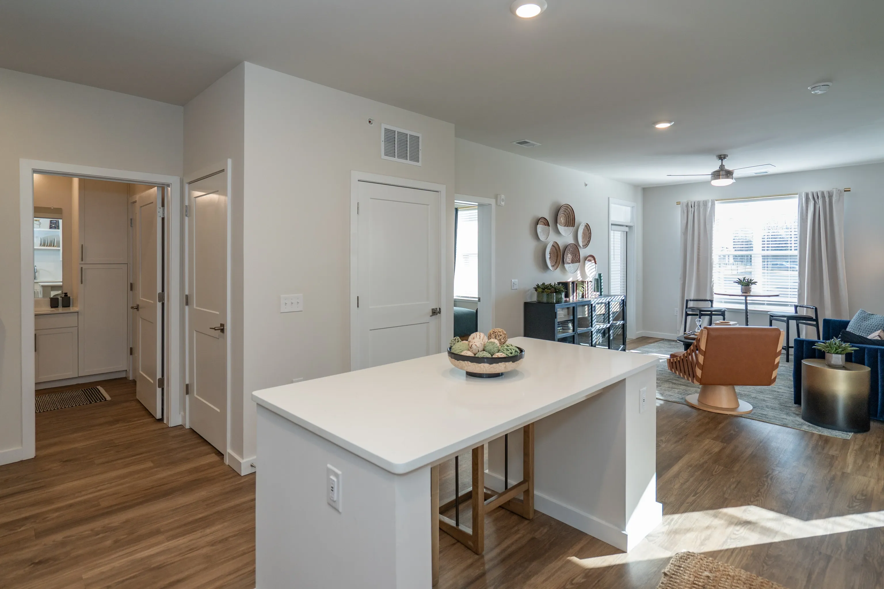 Open concept living area with kitchen island, dining space, and living room.
