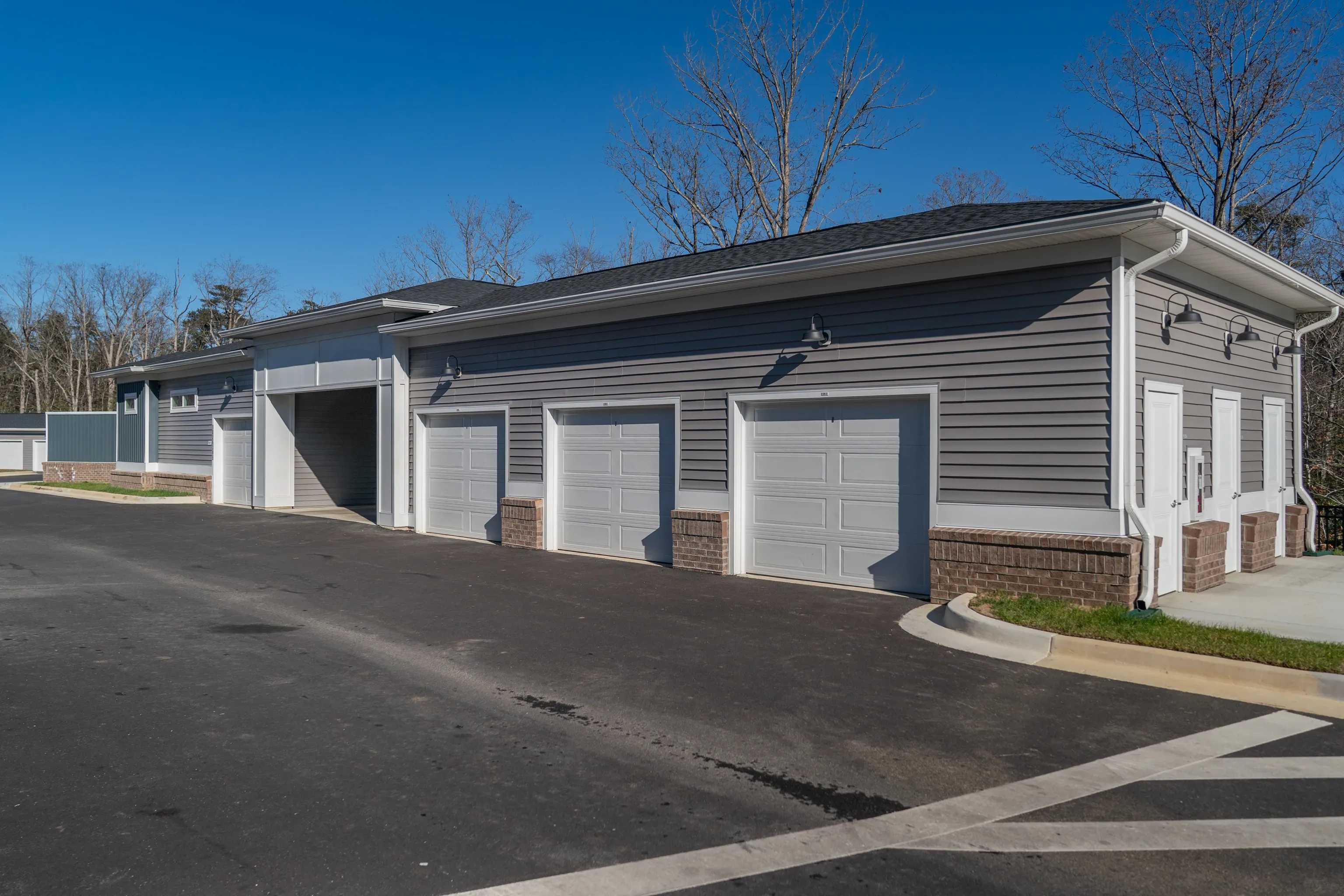 Garage doors and entrances on a multifamily property building.