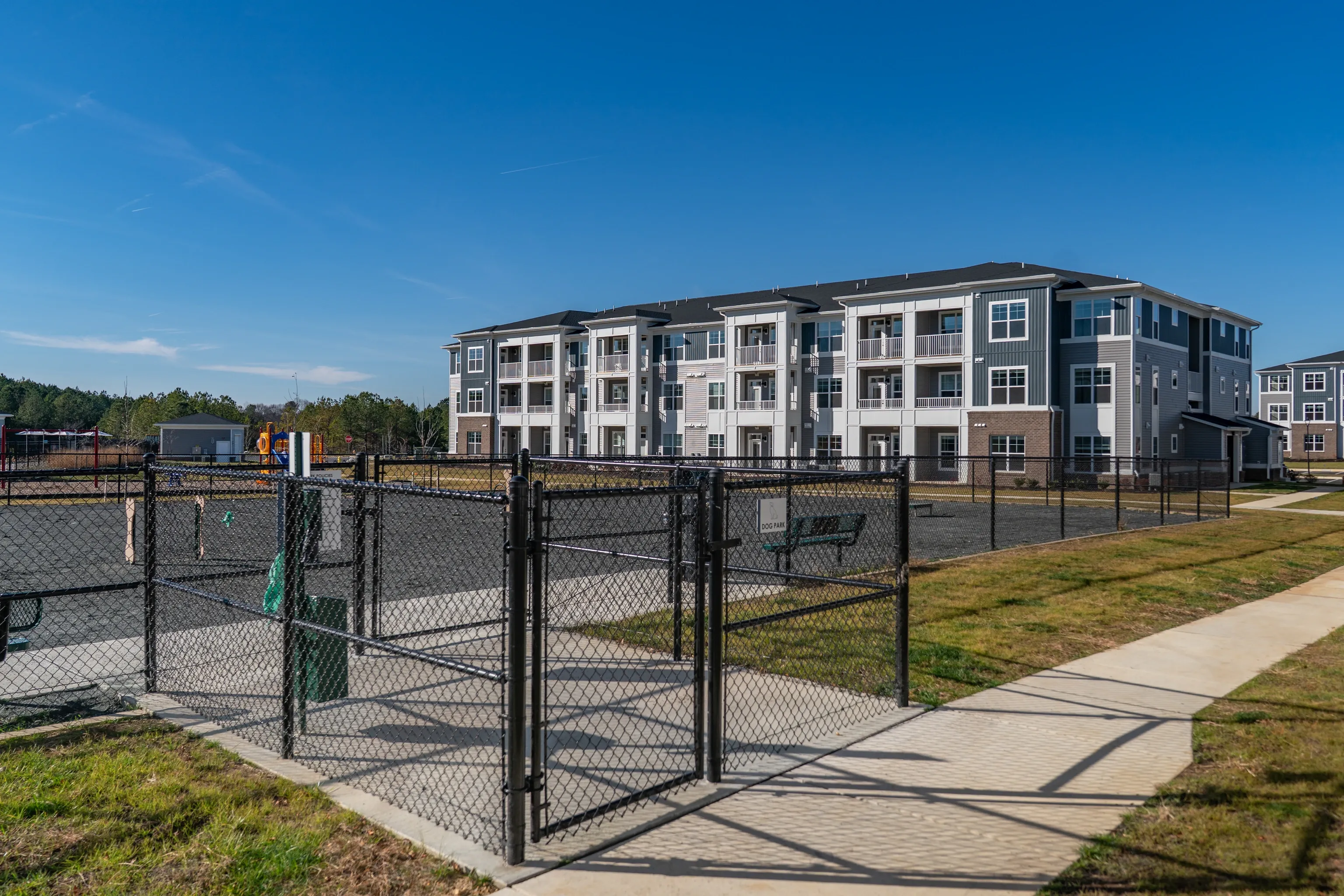 Dog park area in front of apartment building