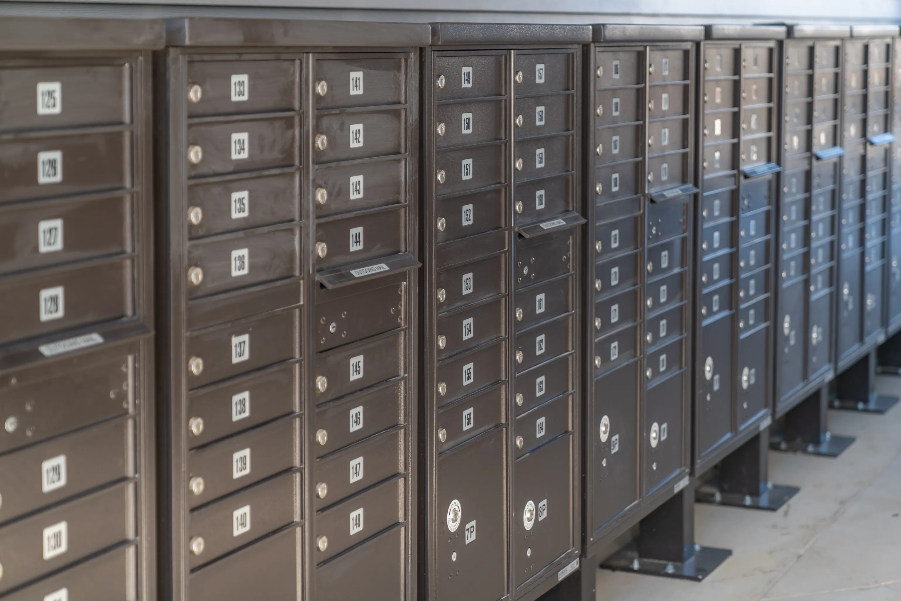 Rows of numbered mailboxes.