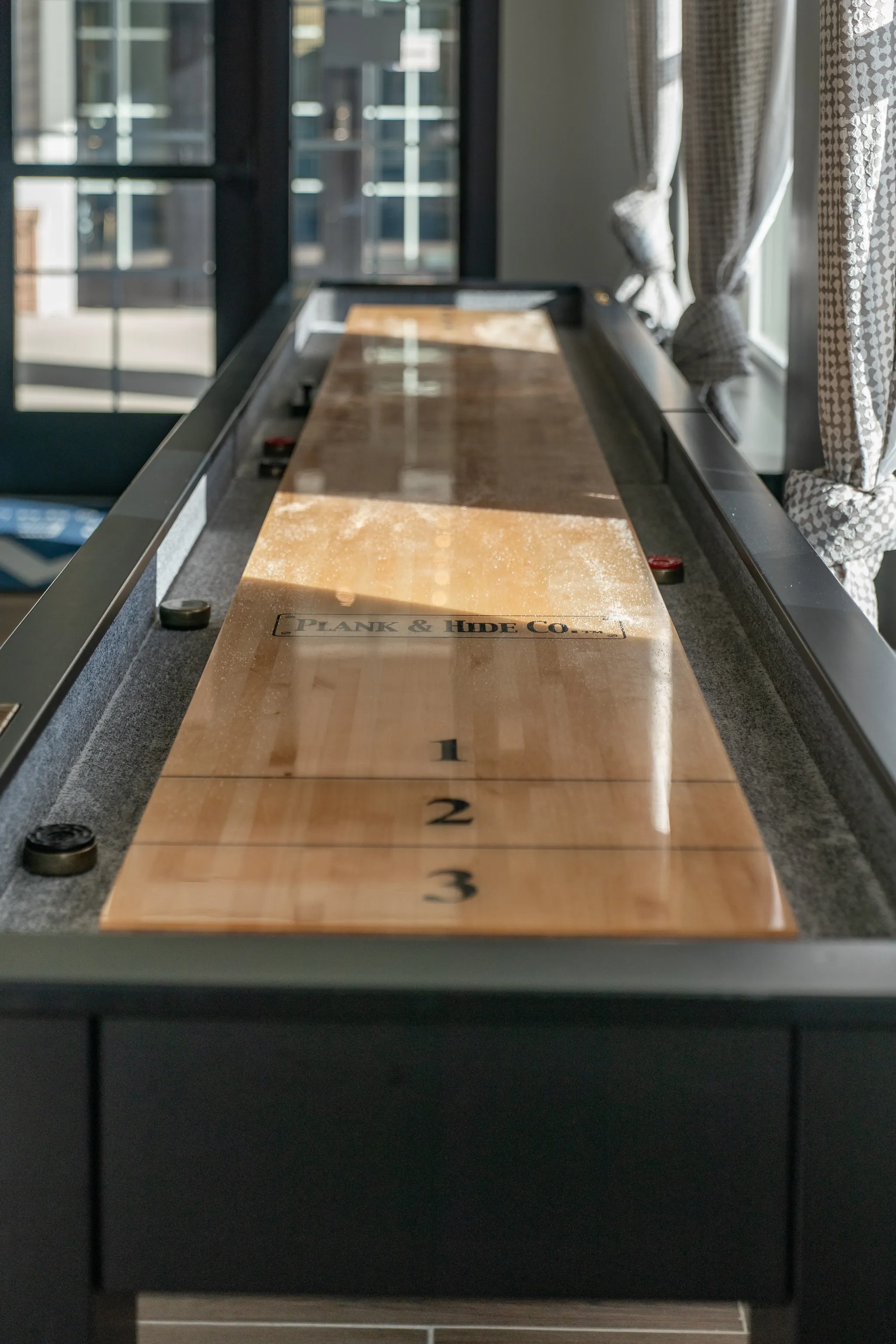 Shuffleboard table in a community game room.